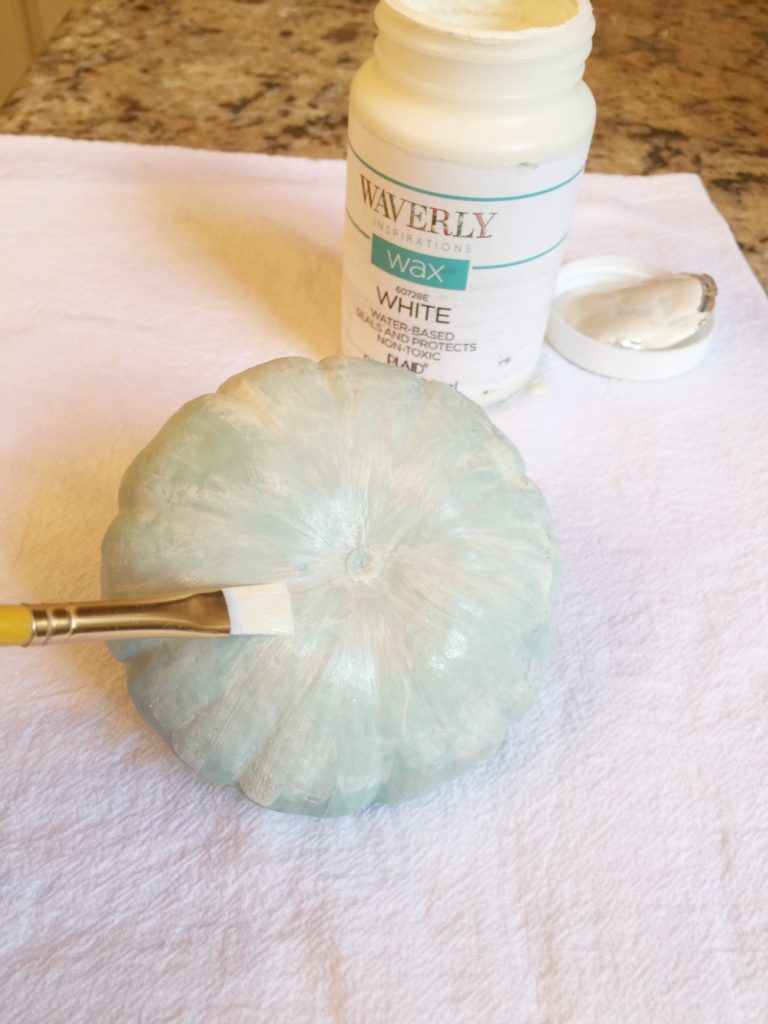 Apply white wax to your painted pumpkins