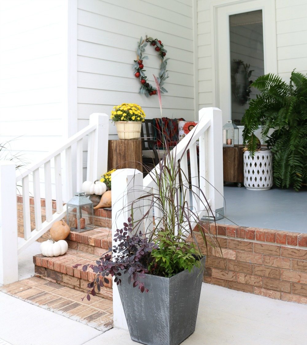 Planters with fall foliage for the side entry