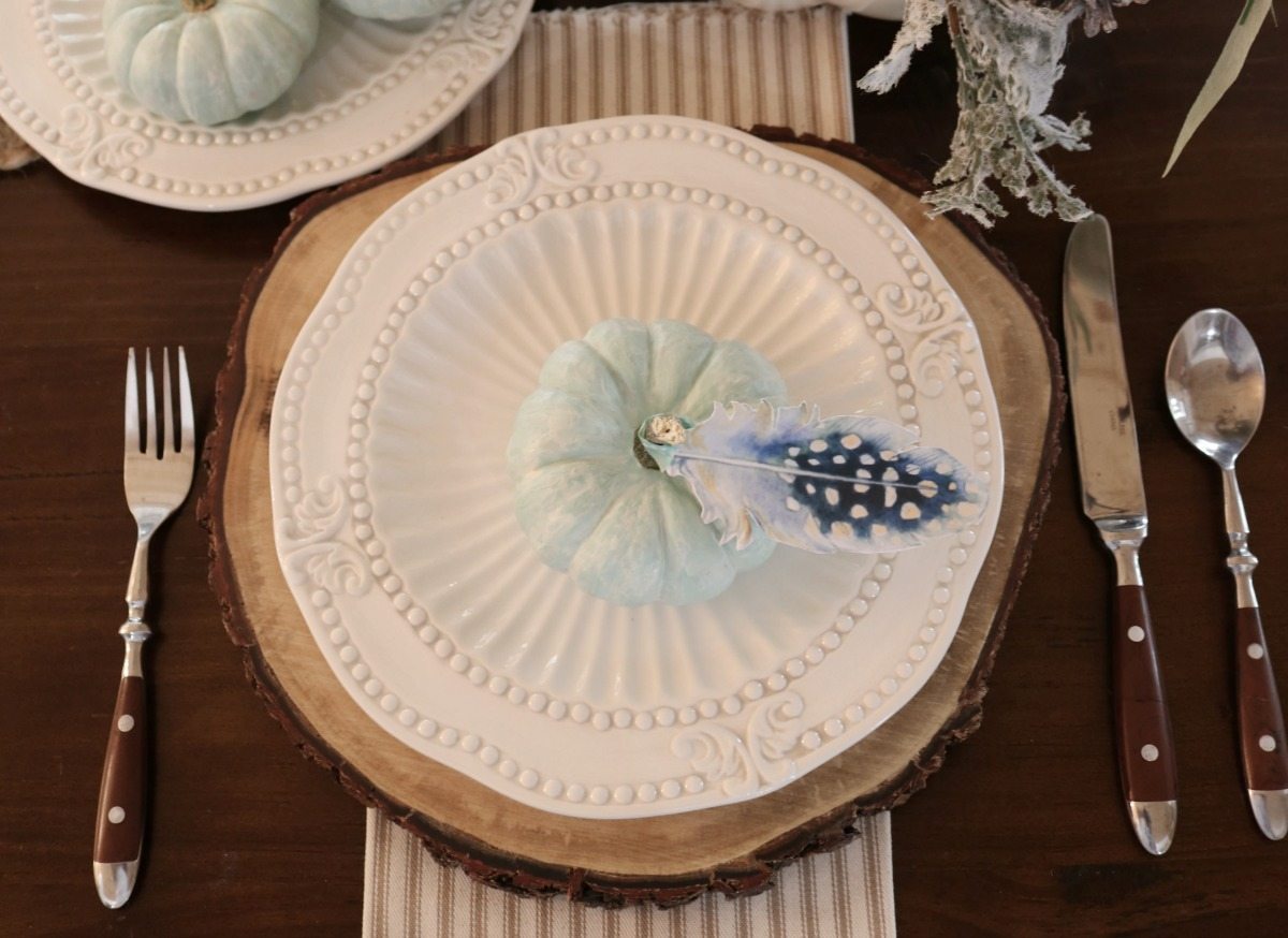 Soft blue pumpkins and paper feathers