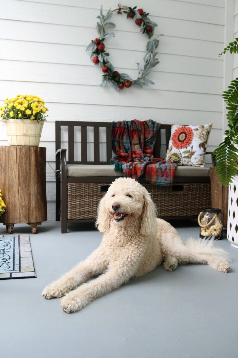 Storage bench at entry decorated for fall