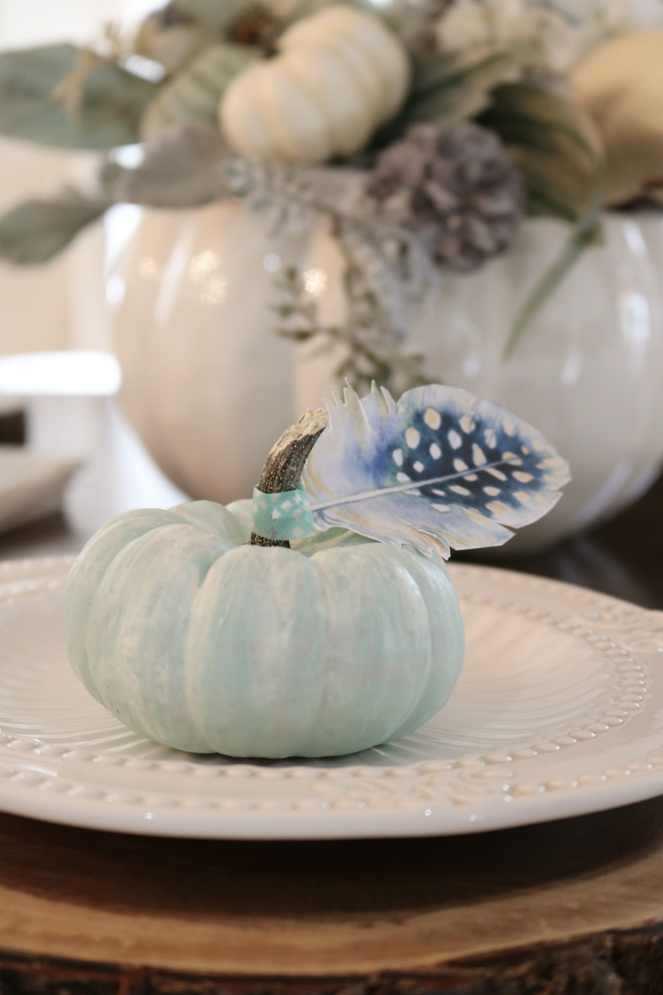 Tiny blue pumpkins with paper feathers