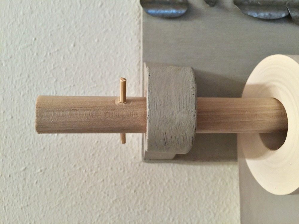 To keep the paper on the dowel