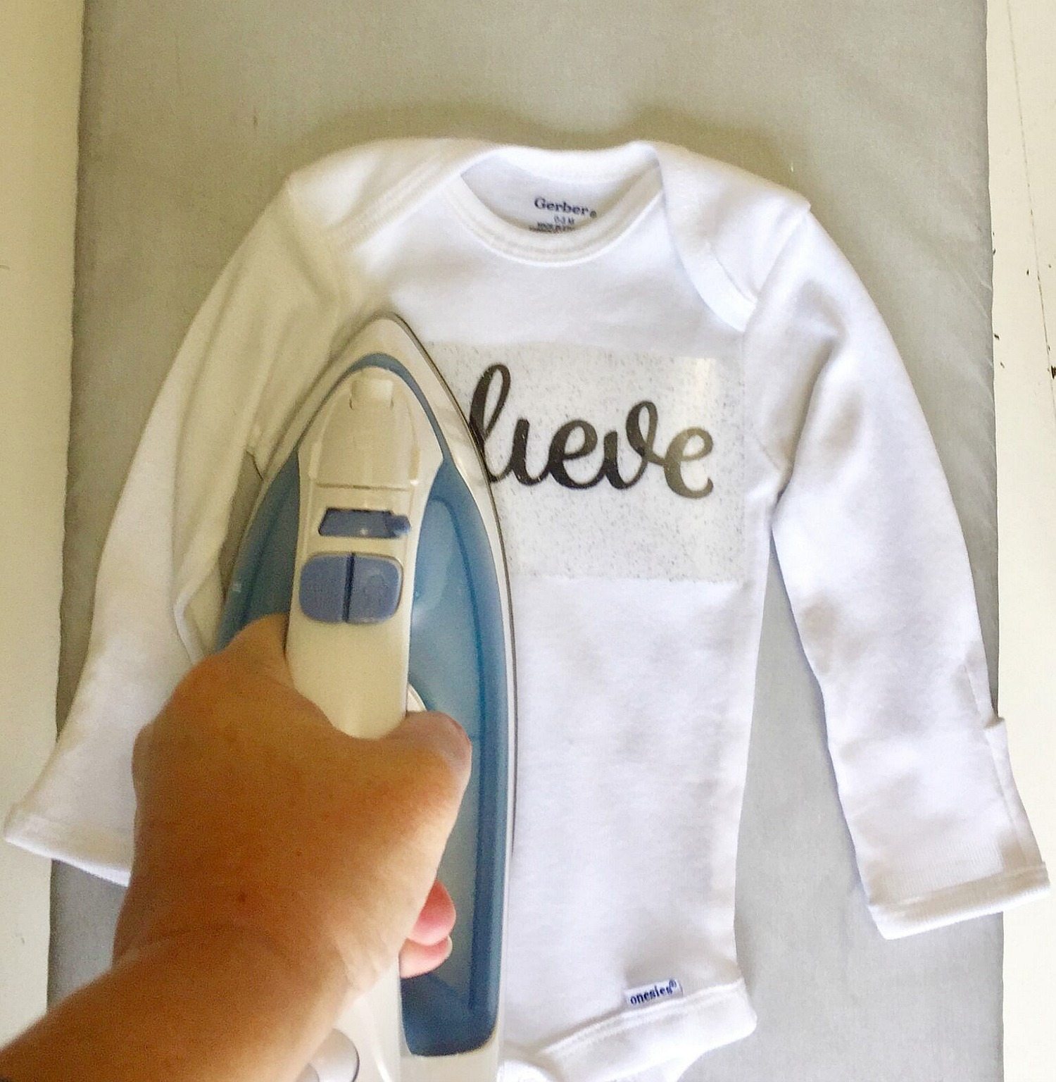 Apply heat and pressure for baby onesie