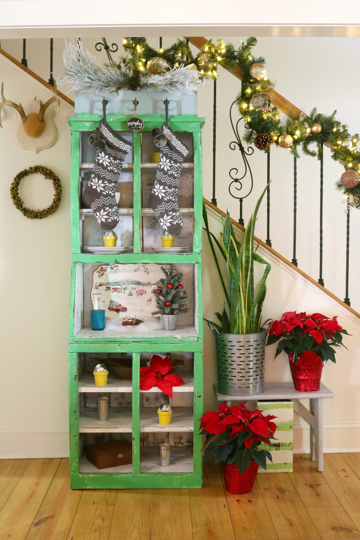 Green cabinet with Christmas decor