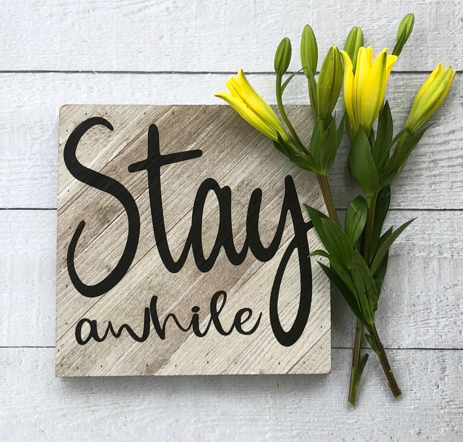 Make this Stay A While farmhouse sign, it's easy with a vinyl cutting machine. Perfect for farmhouse style.