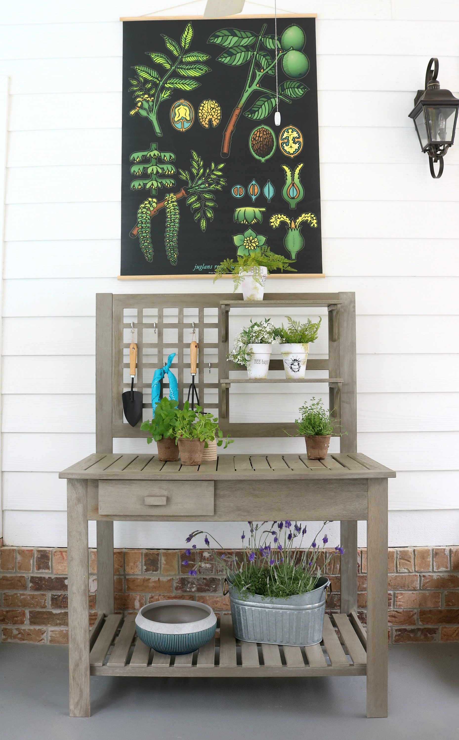 Multi-use potting bench - From planting flowers to entertaining family and friends, our newest addition to the back porch will help with both! A potting bench makes entertaining fun and planting flowers easy. The Camrose Farmhouse Potting bench from Better Homes & Gardens at Walmart #Ad #farmhouse #garden #pottingbench #rustic
