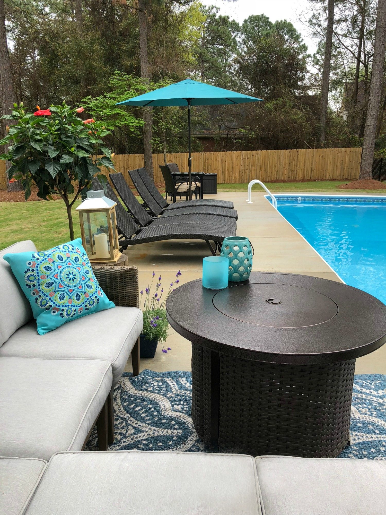 Fire pit doubles as table by the pool