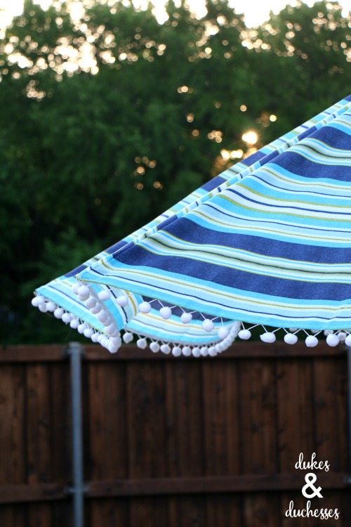 DIY-embellished-umbrella-with-pom-pom-trim