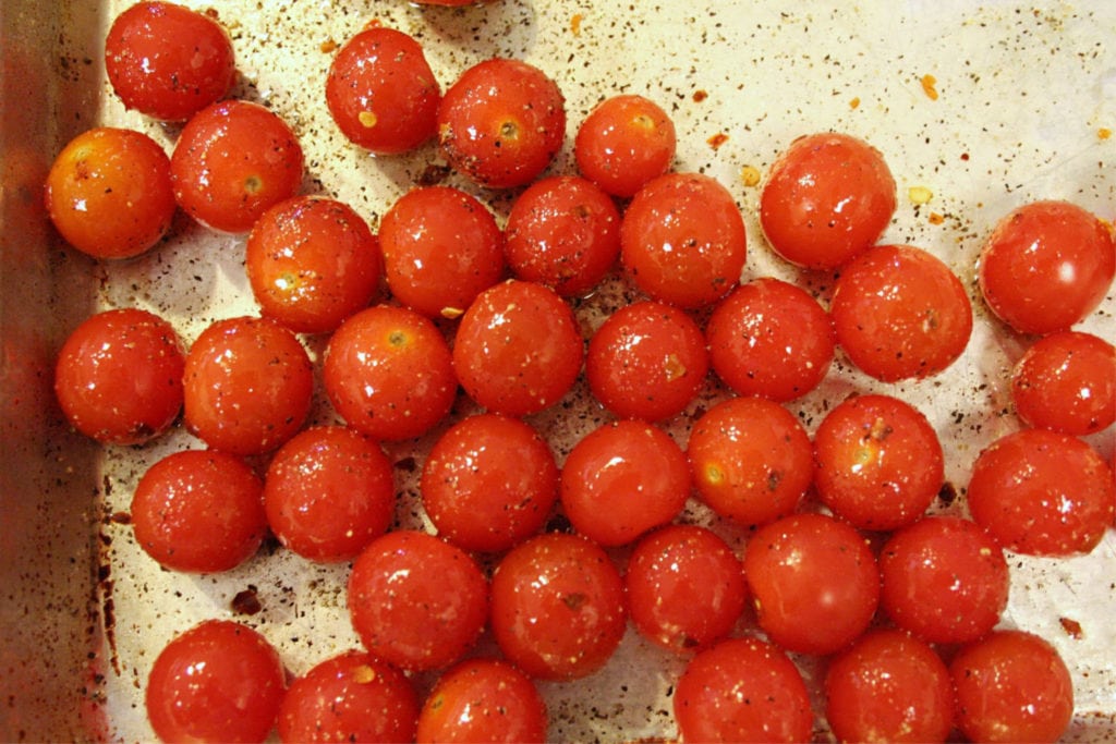 Toss tomatoes in oil spices