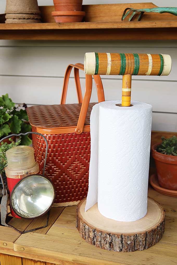 100+ Thrift Store Makeovers - croquet-mallet-paper-towel-holder