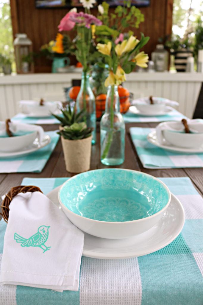 Melamine white dishes with teal bowl.