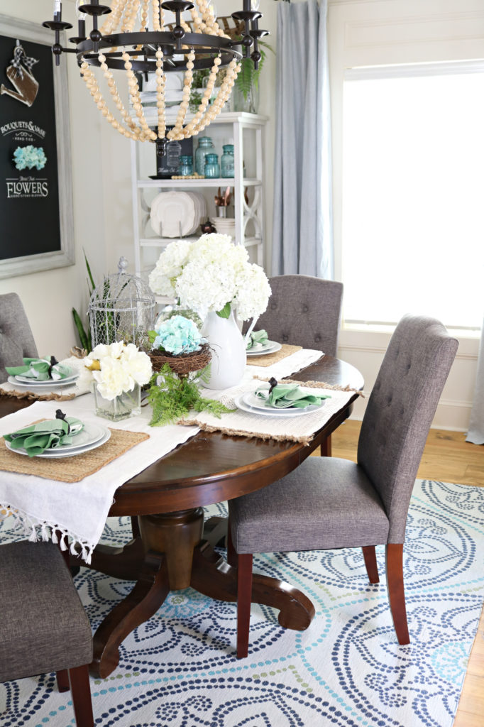 Upholstered chairs plus open shelving in the dining room