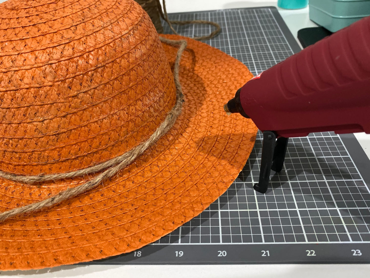 Glue twine on hat