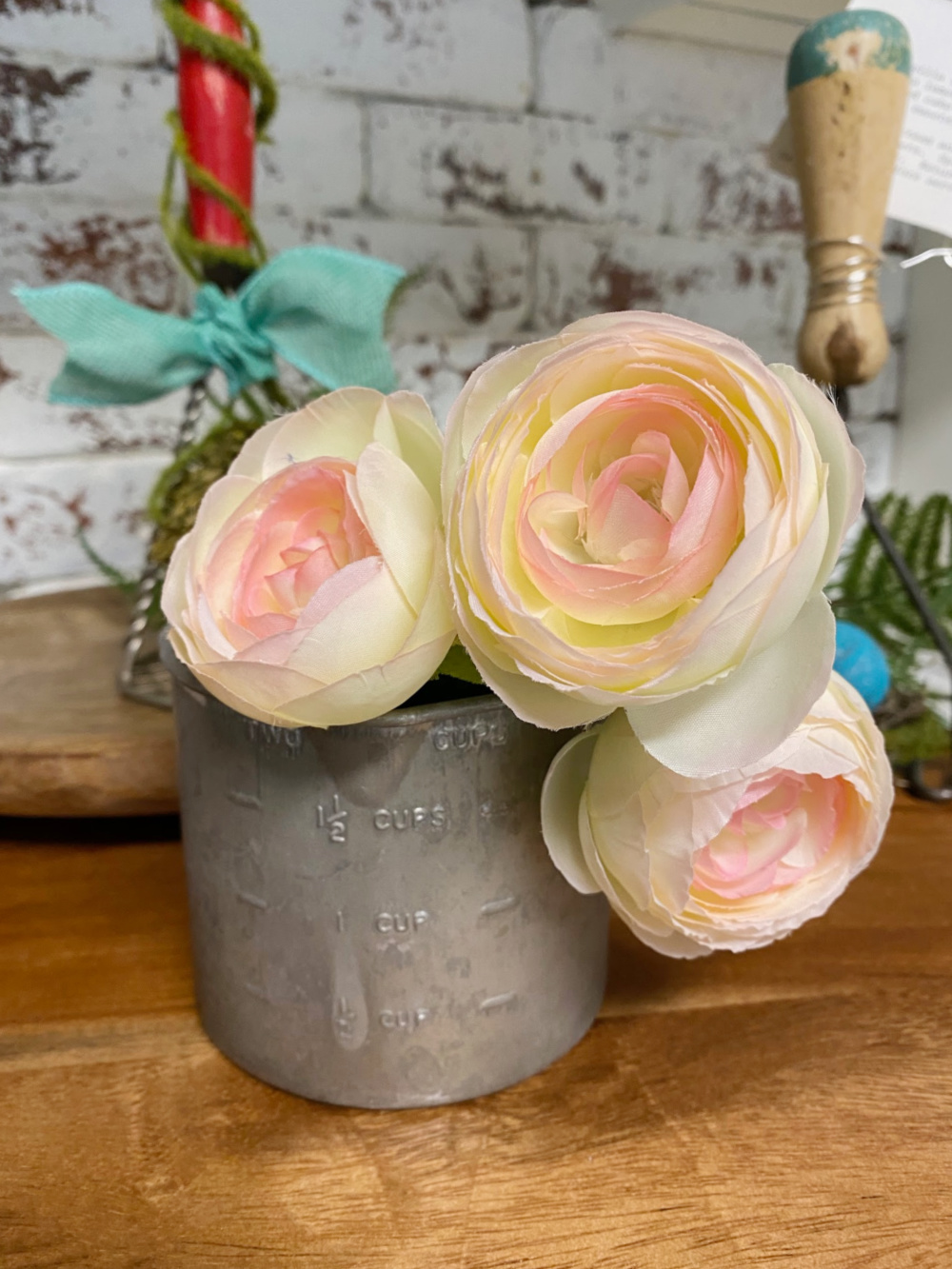 tin measuring cup vase